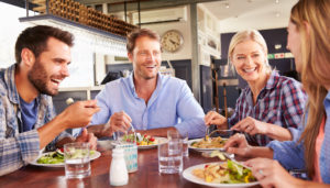 A group of friends eating at a restaurant